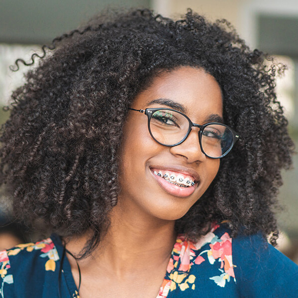 young woman with braces smiling